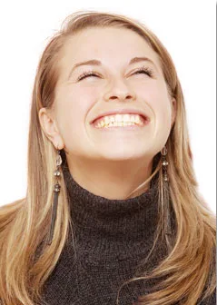 Woman laughing with a wide, confident smile