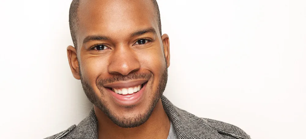Smiling man with straight teeth